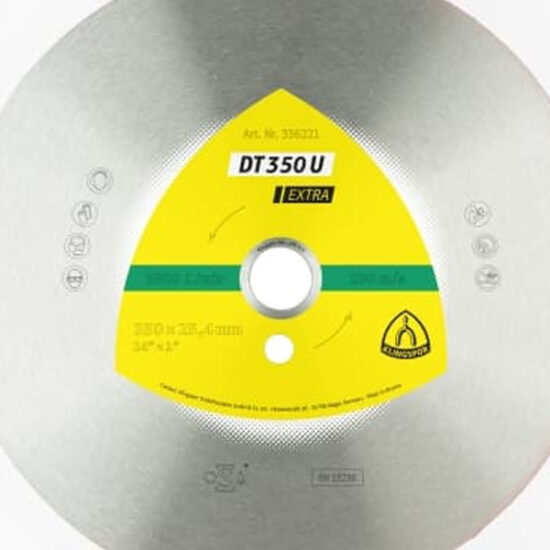 A close-up of the Klingspor 336223 300 x DT 350 U Extra Large diamond cutting blade, featuring a metallic finish and yellow label with product details and safety icons. Designed for construction materials, it resembles typical diamond blades.