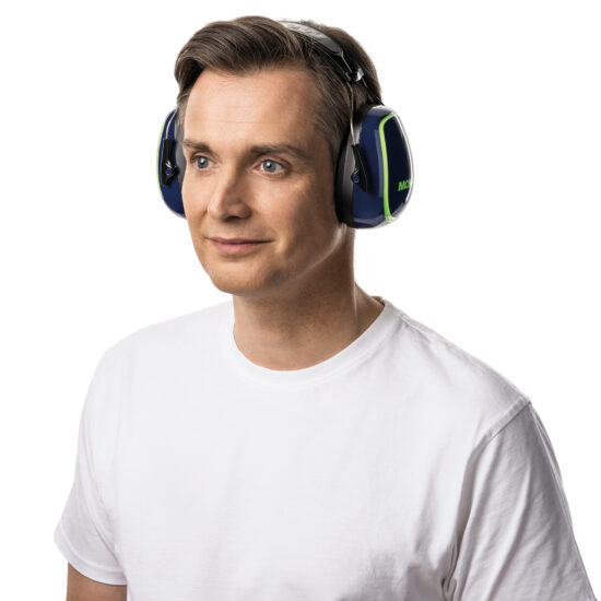 A man in a white t-shirt wears Moldex 6120 Hearing Moldex M-Series M5 Earmuff SNR 34 hearing protection, standing against a white background and looking slightly to the side with a neutral expression.