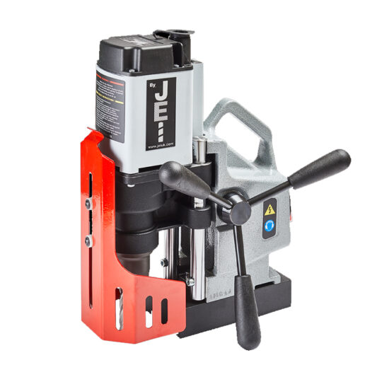 A portable magnetic drill press with a black motor, silver body, red safety guard, and dual black handles, designed for precision drilling in metal surfaces.