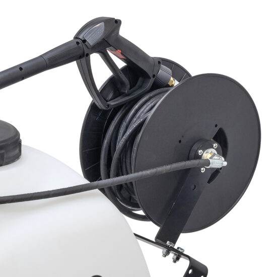 Close-up of a black hose reel with a spray gun attached, mounted on a white tank sprayer. The hose is coiled neatly around the reel, and a metal bracket secures the reel to the tank.