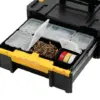 A black and yellow DeWalt DEW170705 TSTAK™ III Toolbox (Deep Drawer) sits open, showing compartments stocked with screws, nails, plastic containers, and rolls of tape.