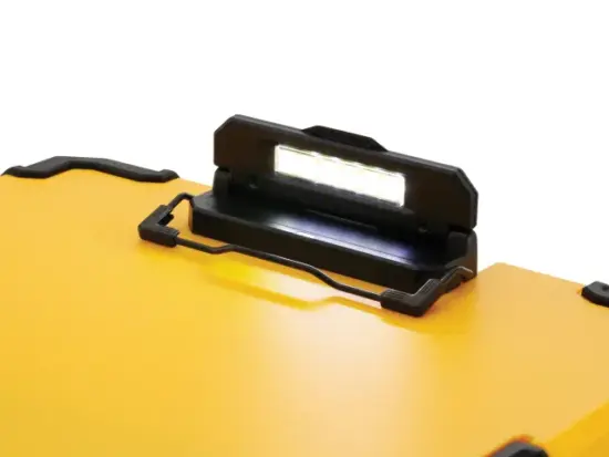A close-up of a bright LED work light attached to a yellow DeWalt portable case with black corner protectors, featuring the DeWalt DEW182732 TSTAK™ Clipboard.