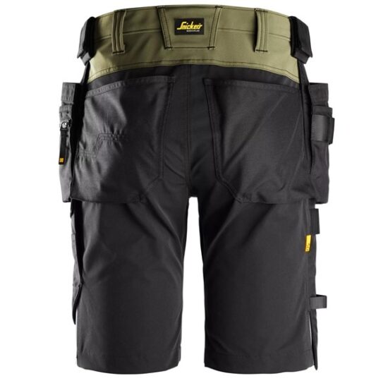Back view of Snickers 6175 AllroundWork, 4-Way Stretch Shorts Holster Pockets in black, showing multiple tool and holster pockets, utility loops, and a visible yellow Snickers label on the waistband.