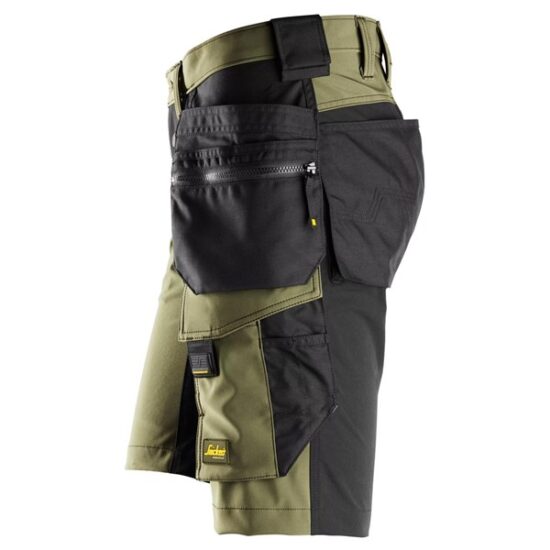 Side view of Snickers 6175 AllroundWork 4-Way Stretch Shorts in black, featuring holster pockets, multiple reinforced pockets, zippers, and loops for carrying tools and accessories.