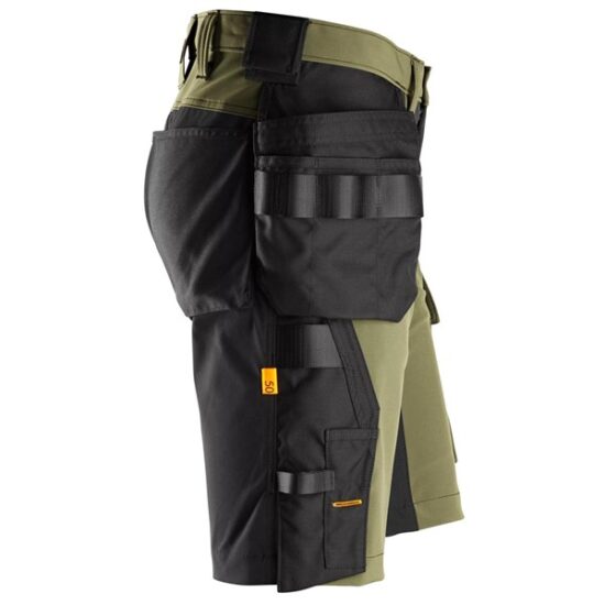 Side view of Snickers 6175 AllroundWork 4-Way Stretch Shorts in black, featuring holster pockets and tool loops—ideal for heavy-duty or professional use.