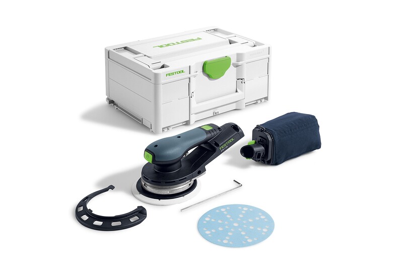 A black and green electric sander with a dust bag, sanding disc, wrench, sanding pad, and white carrying case with a green latch, all arranged on a white surface.