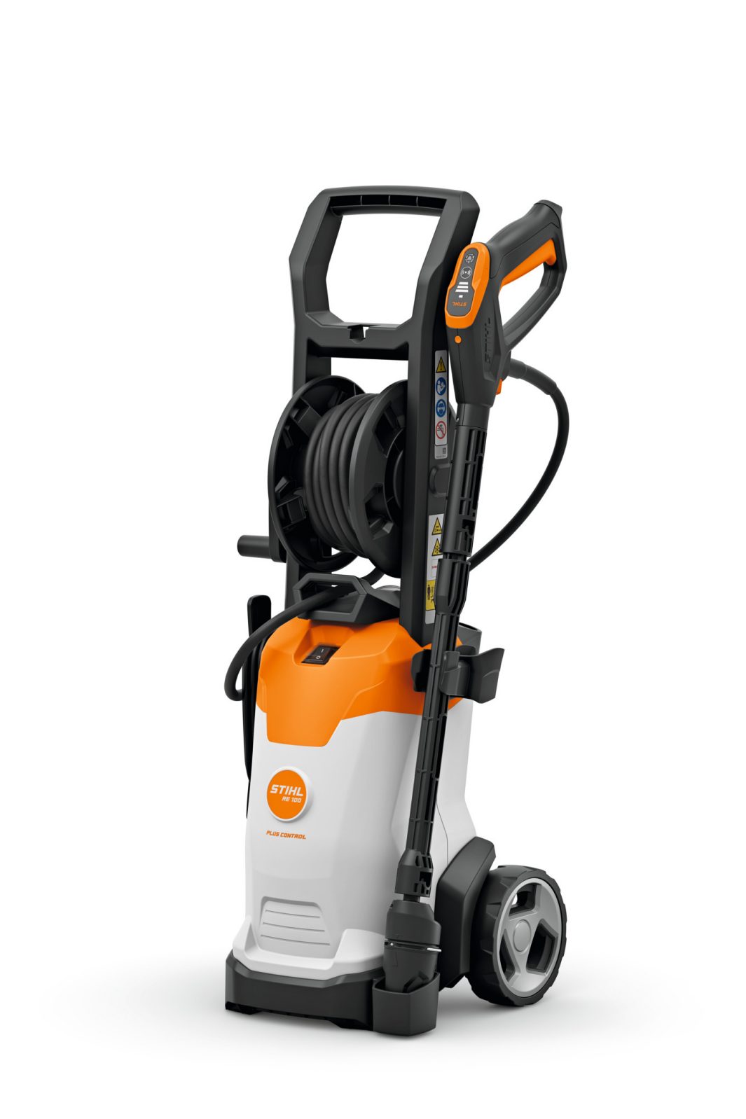 The Stihl RE100 Pressure WasherRE02 011 4531 features a compact upright design, orange and white body, large rear wheels, hose reel, and attached spray gun, shown against a plain white background.