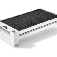 A rectangular, white plastic tray with a textured black surface and three angular compartments on one end, viewed on a white background.