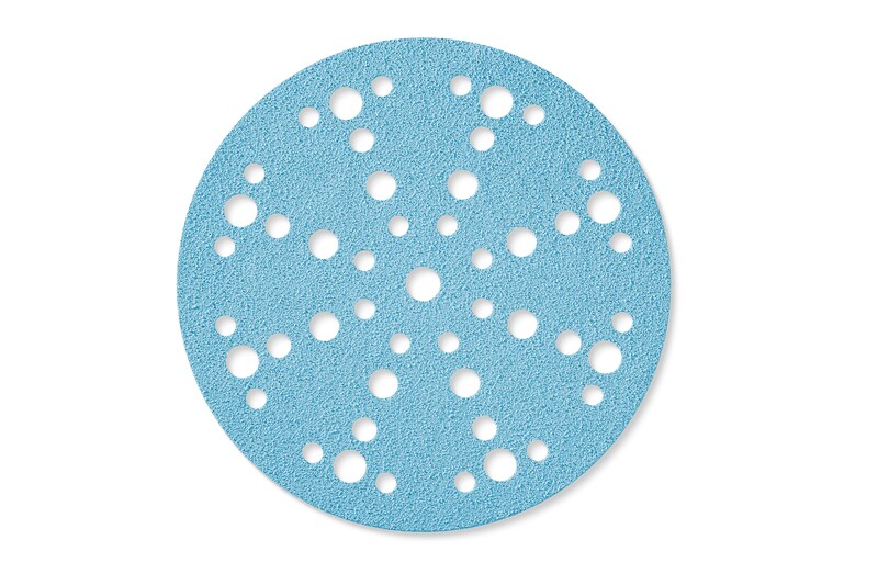 A round, blue sandpaper disc with multiple evenly spaced holes of various sizes throughout its surface, used for sanding and attached to a power sander.