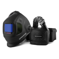 The Migatronic OPERATOR HELMET/PAPR KIT BLACK features a black helmet with a blue viewing window and a flexible hose connecting to the PAPR kit, designed for optimal operator safety.