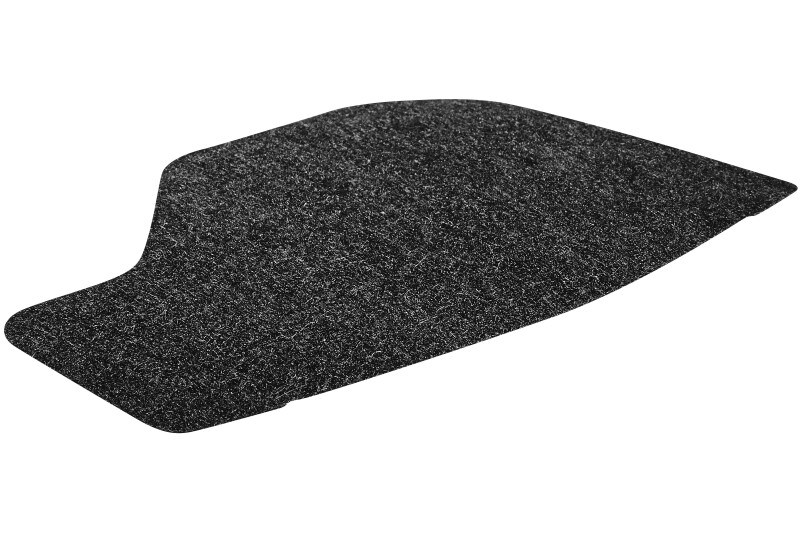 A black, irregularly shaped automotive carpet mat with a slightly textured surface, shown on a white background.