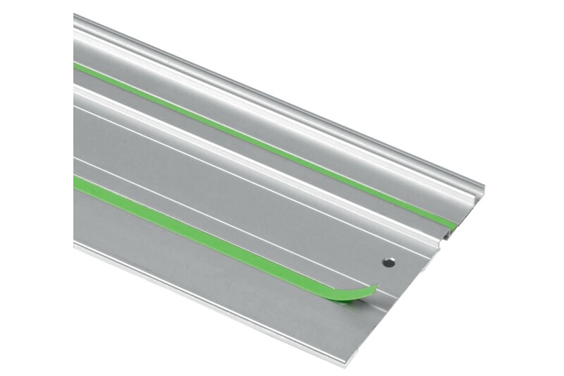 A close-up of a silver metal track with two green rubber strips, featuring a beveled edge and a small hole near the corner.