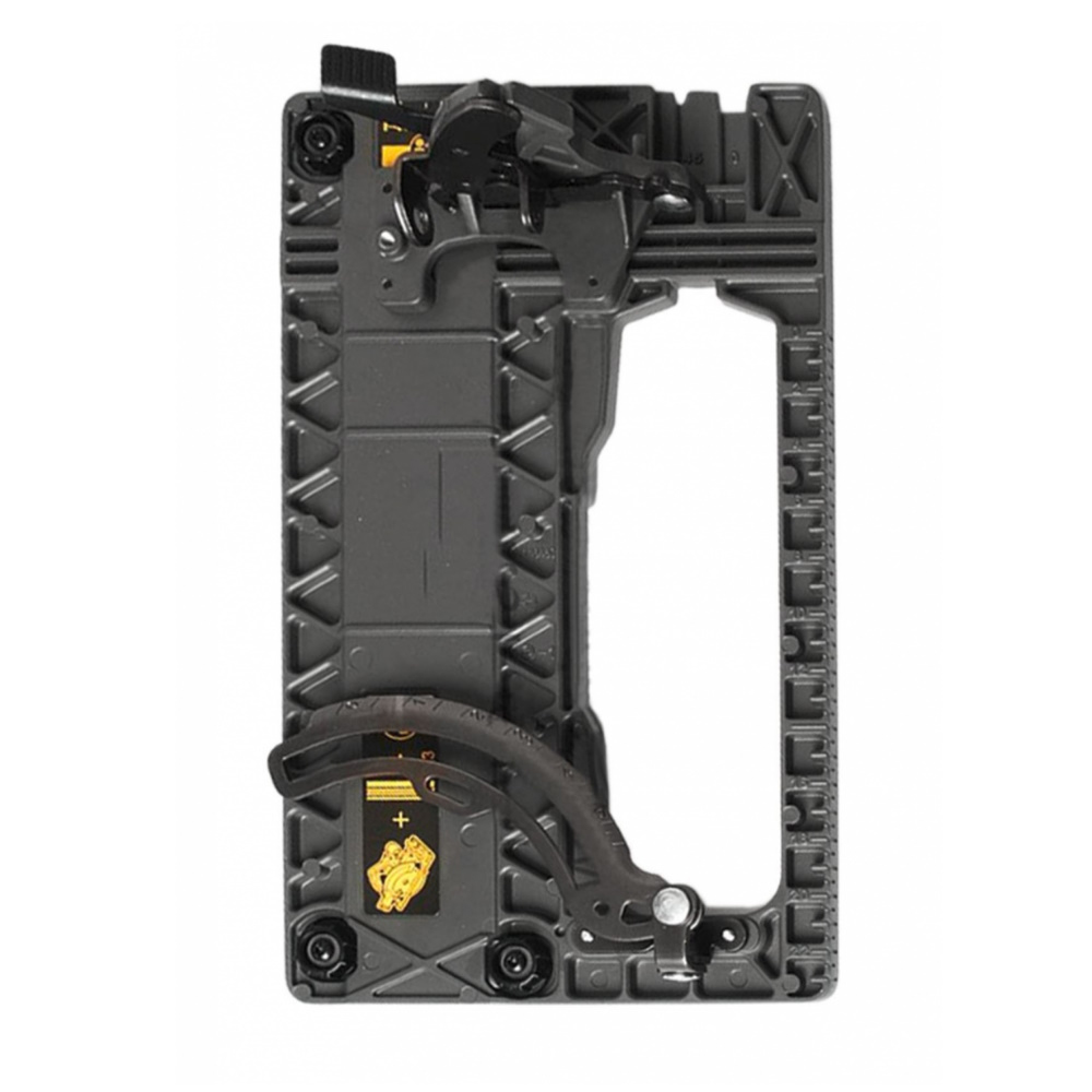 The Dewalt N472354 Circle Saw Shoe Base + Guide Rail Slots is a rectangular black plastic and metal device with gears, levers, and measurement markings, shown against a white background.