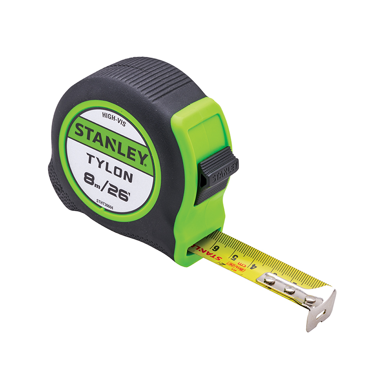 A Stanley Tylon tape measure with a black and green case and its yellow measuring tape partially extended.