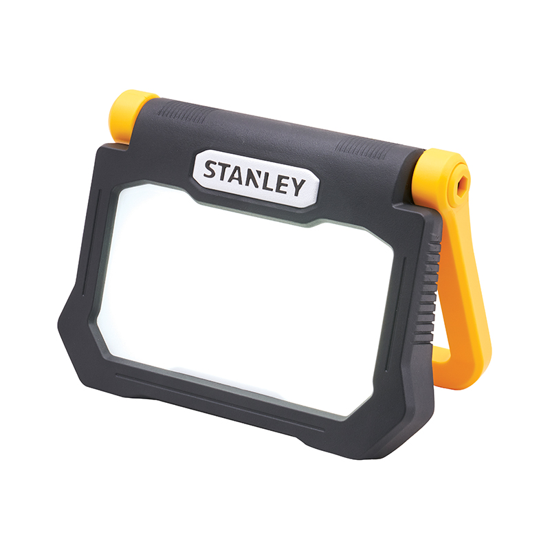 A portable Stanley LED work light with a black frame, white light panel, and yellow adjustable stand for workshops or construction sites.
