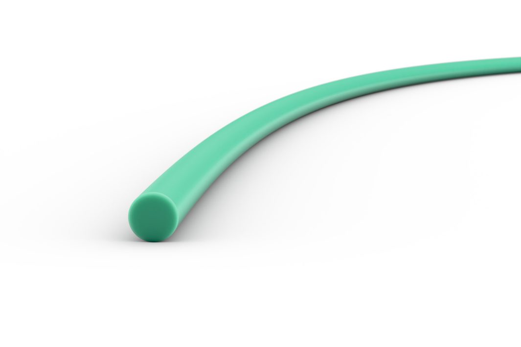 A close-up of a green flexible tube or cable on a white background, curving gently to the right.