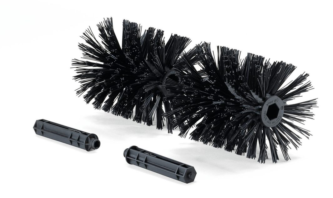 Two cylindrical black brush rollers with dense bristles and two black plastic attachment pieces are displayed on a white background.