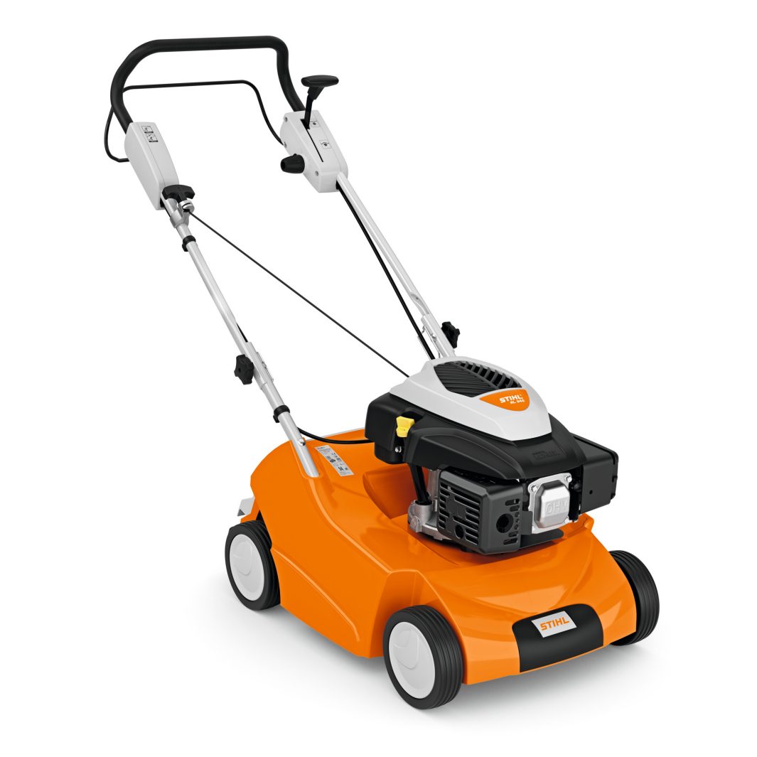 A bright orange and black STIHL lawn mower with four white wheels, a black handle, and a silver engine cover for cutting grass.