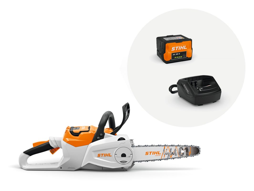 A STIHL battery-powered chainsaw with its battery and charger displayed separately in a circular cutout above the saw.