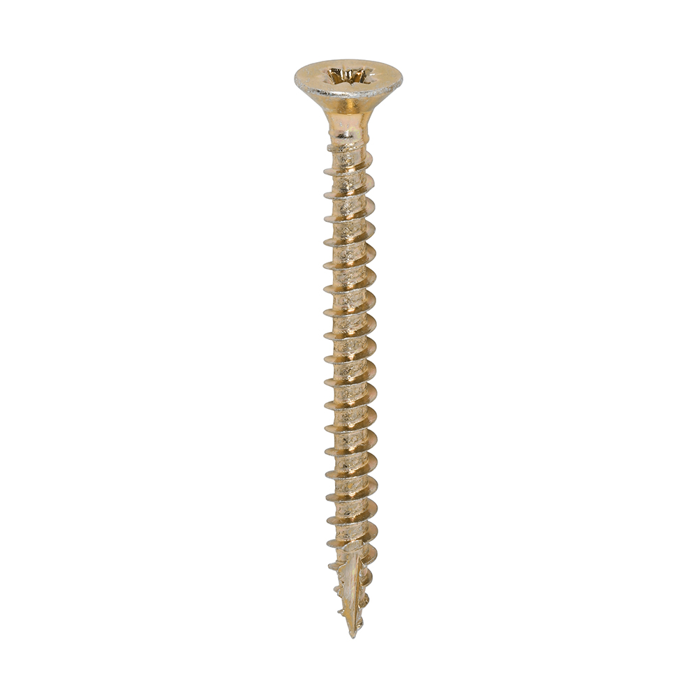 A single gold wood screw with a flat, countersunk head and sharp threaded shaft on a white background.