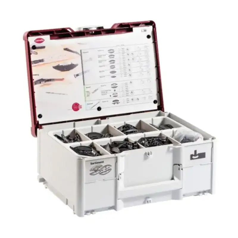 An open organizer box with compartments holding various small black P-System connectors and an instruction sheet inside the red lid.