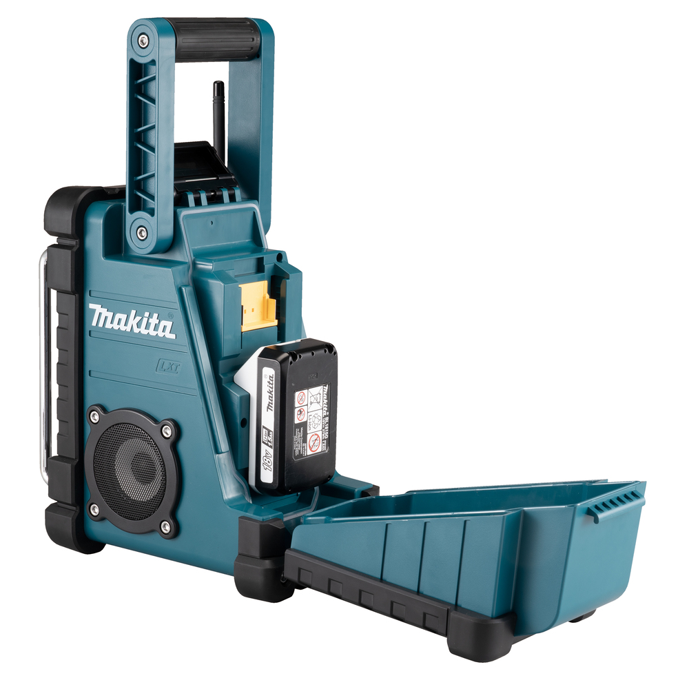 A teal Makita portable radio with a handle, speaker, and battery pack. The open front compartment reveals internal components.