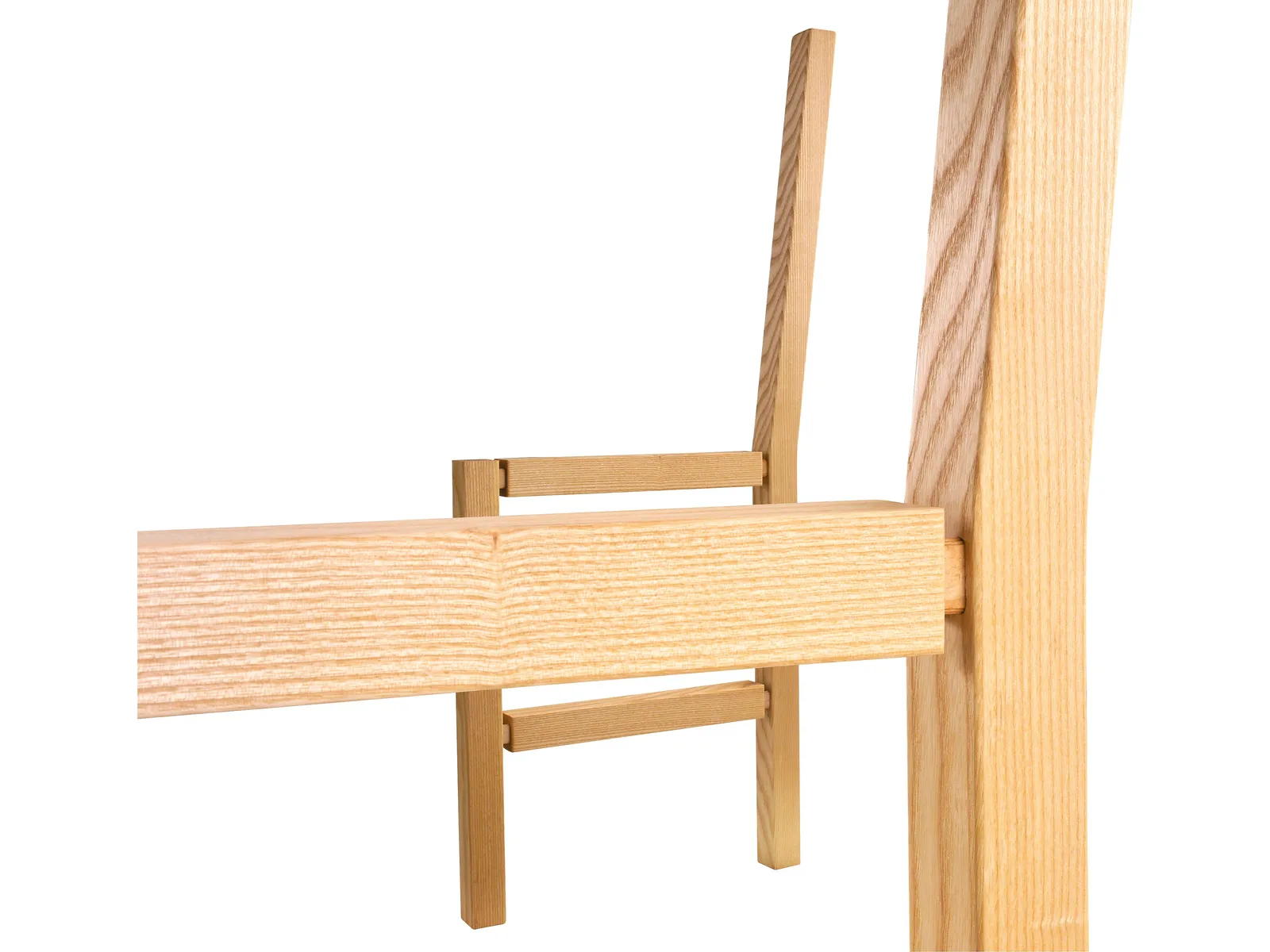 Close-up of light-colored wooden pieces joined at right angles, possibly part of furniture assembly, on a plain white background.