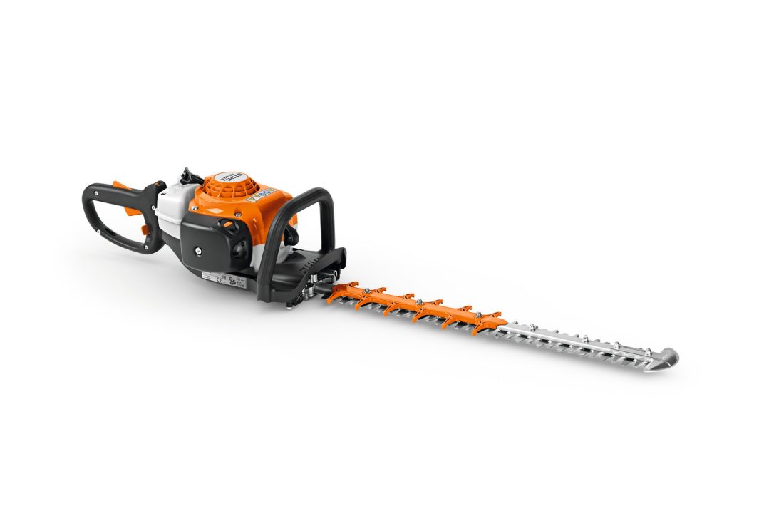 The Stihl HS82R-CE 24" Hedge Trimmer features an orange and white motor housing, black handles, and a long silver dual-action blade.