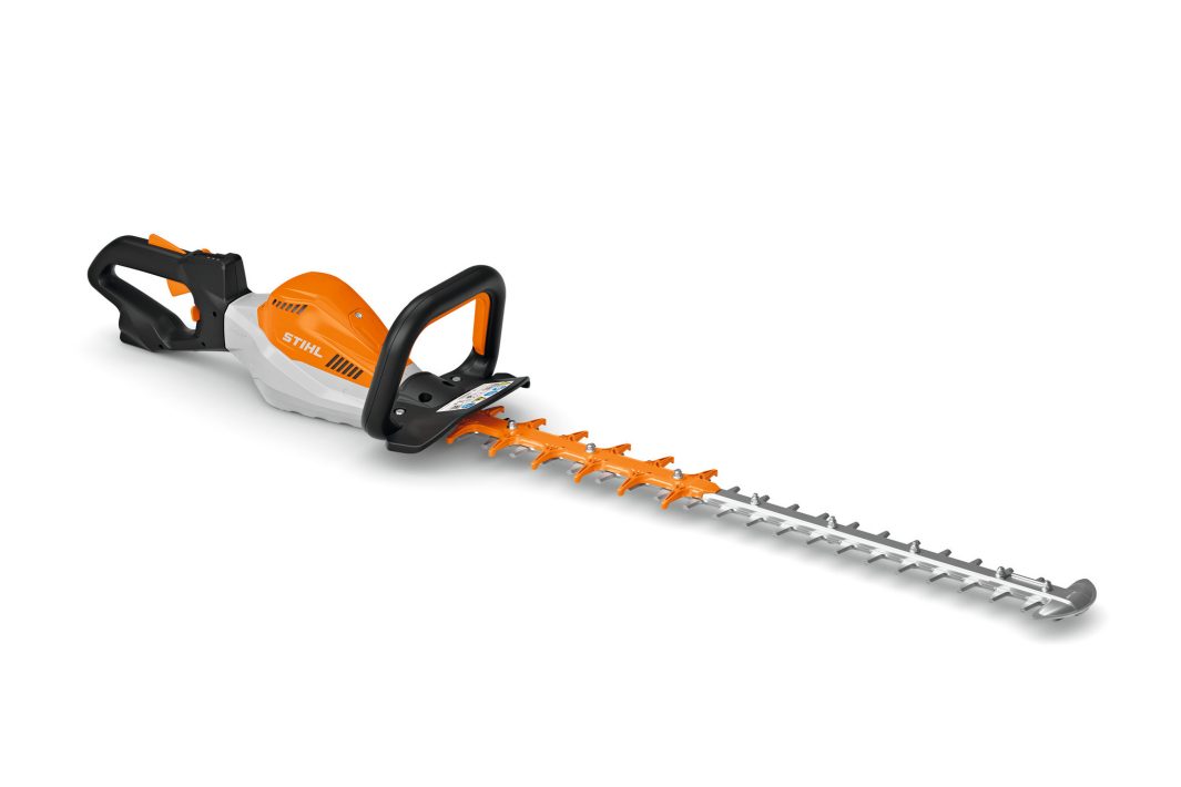 A Stihl HSA 130R 30" cordless hedge trimmer with a silver blade, orange and white body, and black handle on a white background.