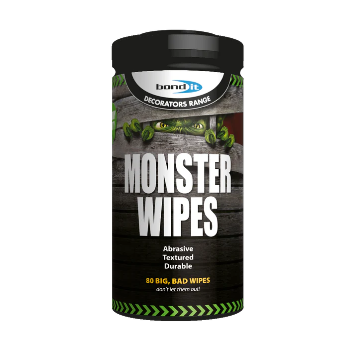 A tub of Heavy Duty Monster Wipes with a monster’s green eyes and claws behind wood planks; contains 80 durable, textured wipes.