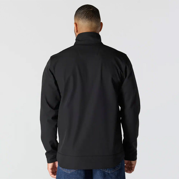 A person with short hair is seen from behind, in a black jacket and blue jeans, against a light background, wearing a Bordeaux Carhartt TK5858 Force Relaxed Fit Short Sleeve Lightweight T-Shirt.