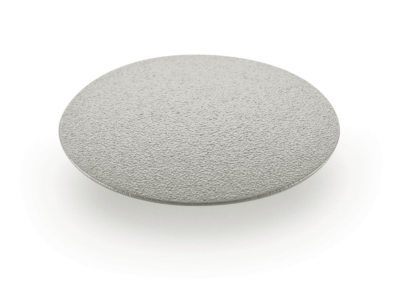 A round, flat, textured gray disc on a white background casts a soft shadow underneath it.