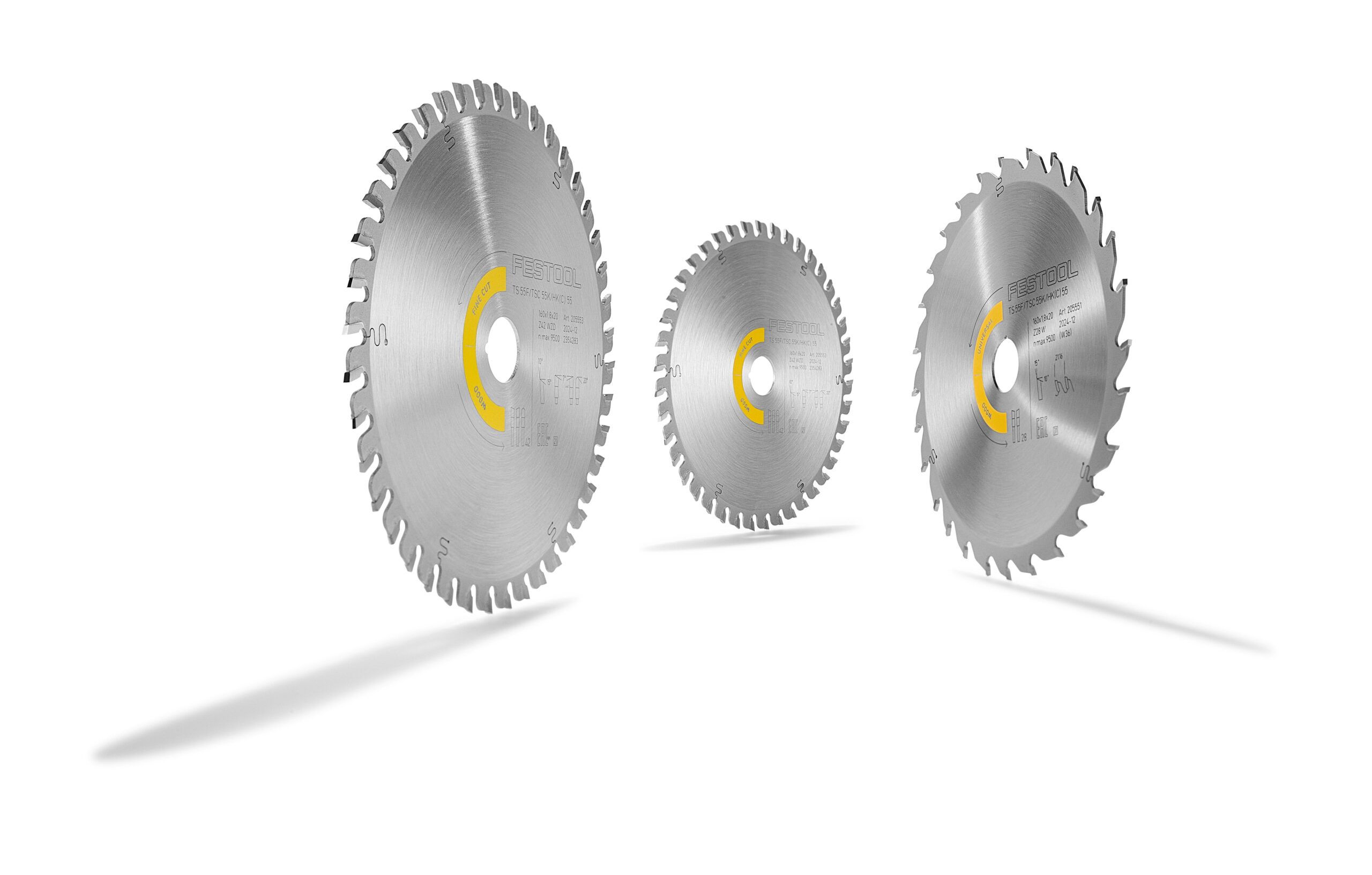 Three circular saw blades, including the Festool 578547 set, stand upright on a white background, casting long shadows left.