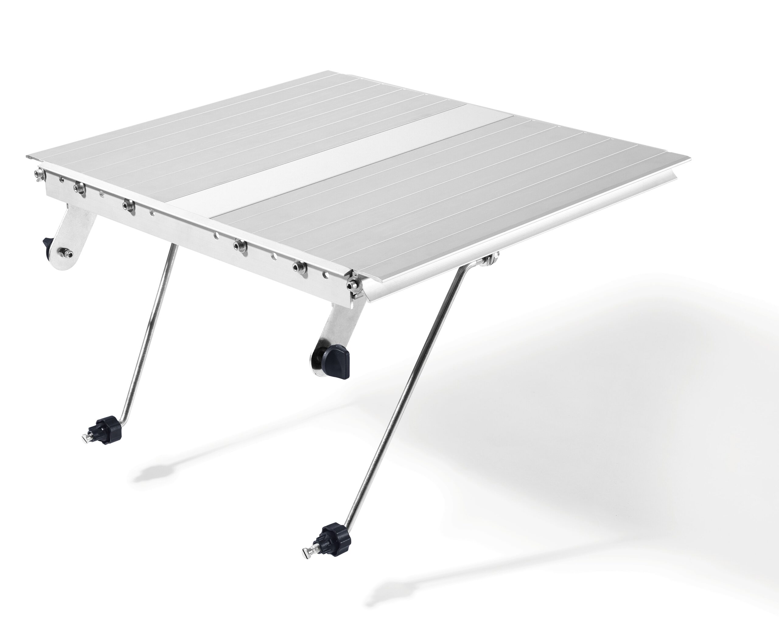 A portable, foldable aluminum table with two adjustable legs extended stands on a white background. The tabletop has striped and solid sections.