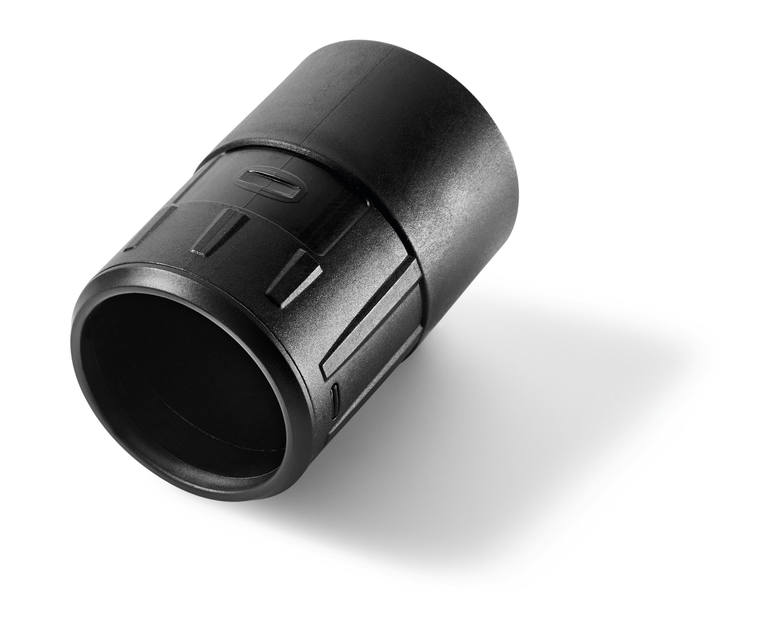 A black cylindrical plastic connector or adapter with ridged sides, displayed at an angle on a white background with a soft shadow.