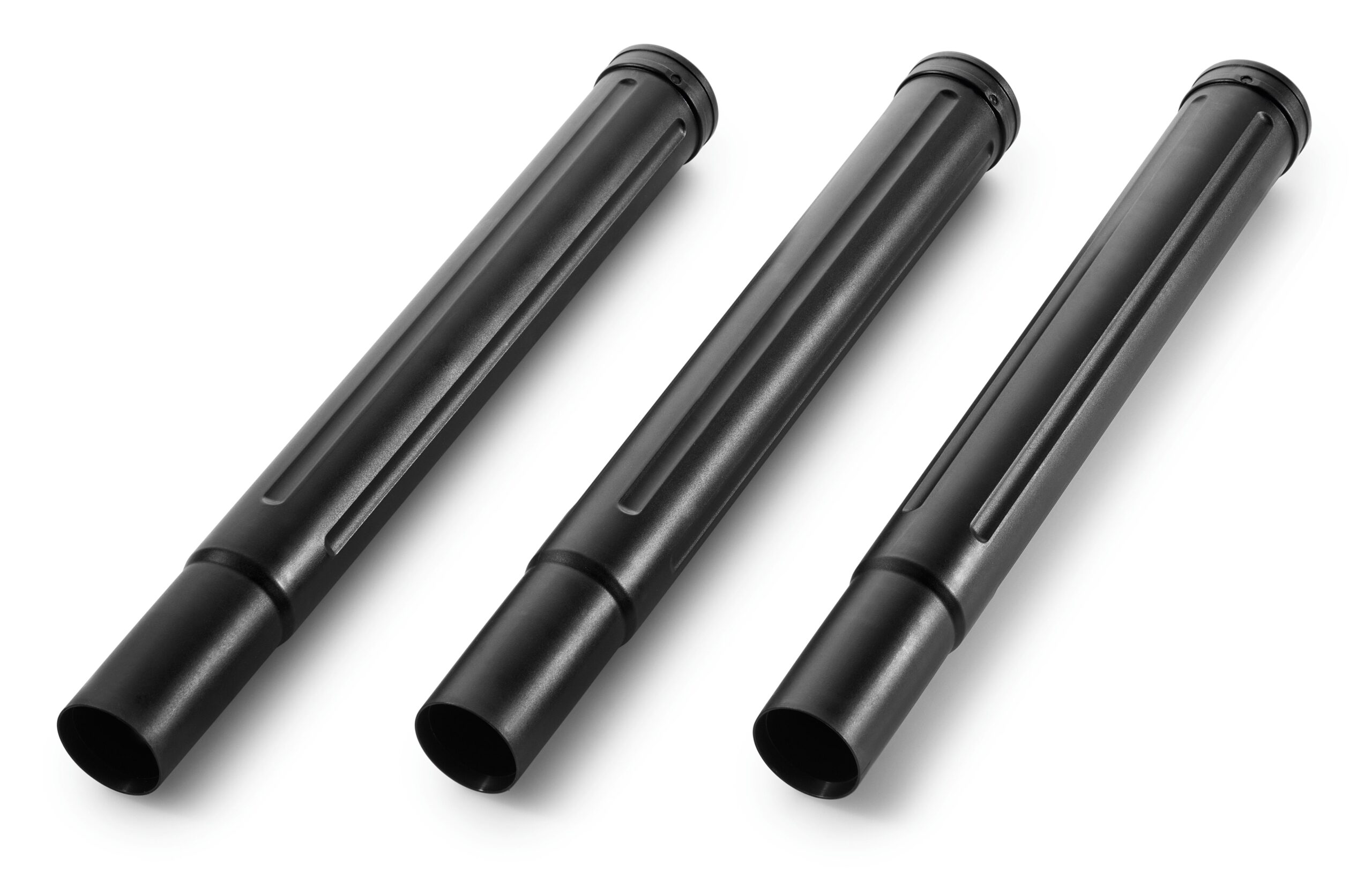 Three black cylindrical extension tubes lie diagonally on a white surface, each with a smooth finish and evenly spaced grooves.