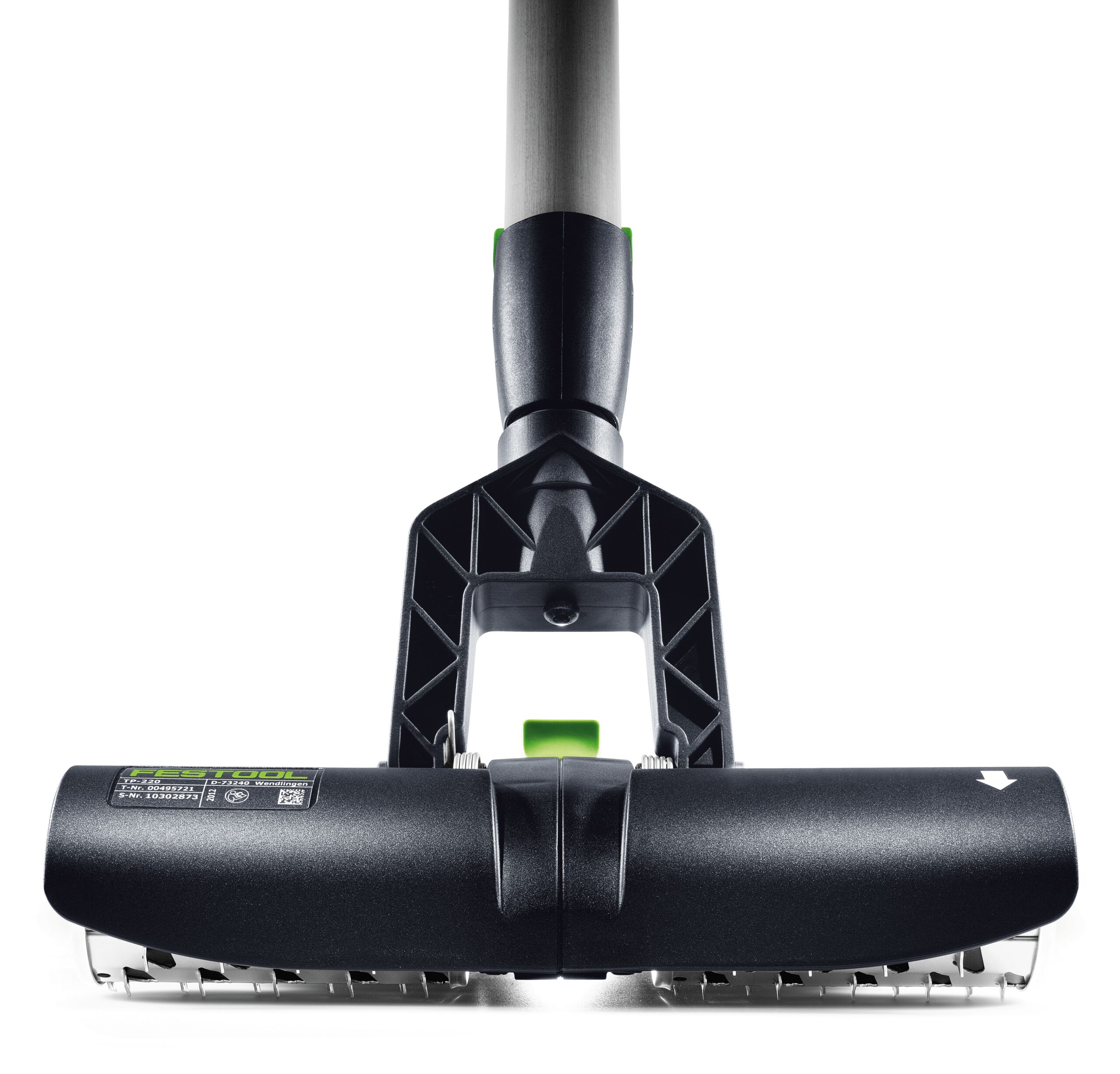 Close-up of the Festool 495747 Wallpaper perfo TP 220 in black and silver with a green button on white, bristles visible underneath.