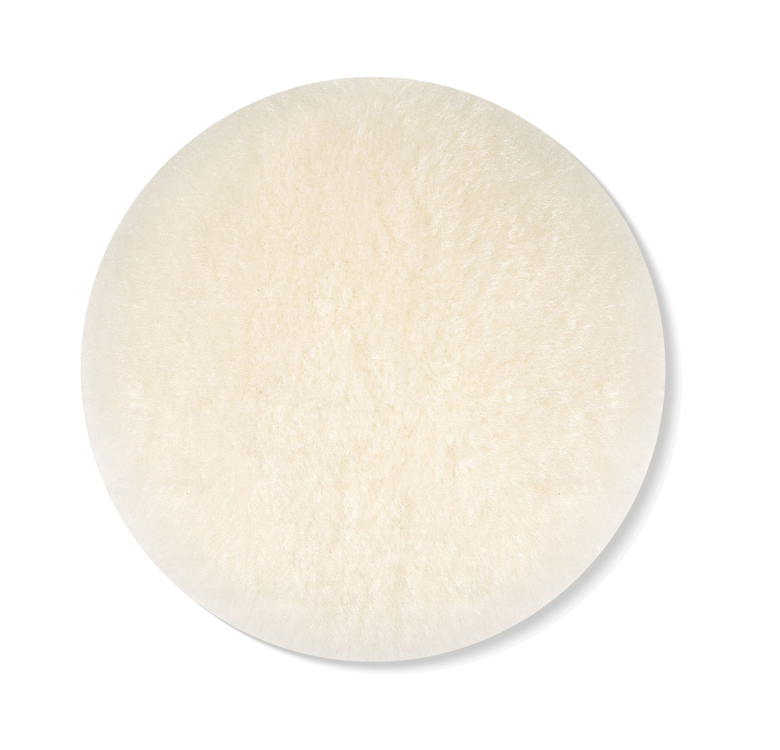 A round, white, fluffy pad with a soft texture is shown from above on a simple white background.
