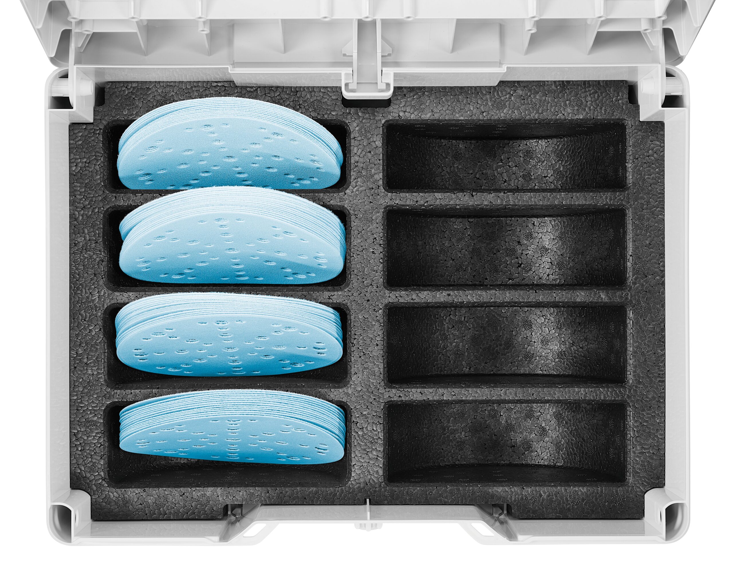 An open plastic storage case with four stacks of blue crescent-shaped pads in black foam; four empty slots are on the right side.