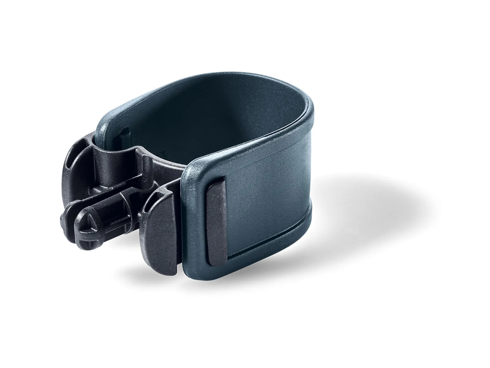 A dark gray plastic clamp with a curved, open-ended design and latch mechanism lies on a white background with a soft shadow.