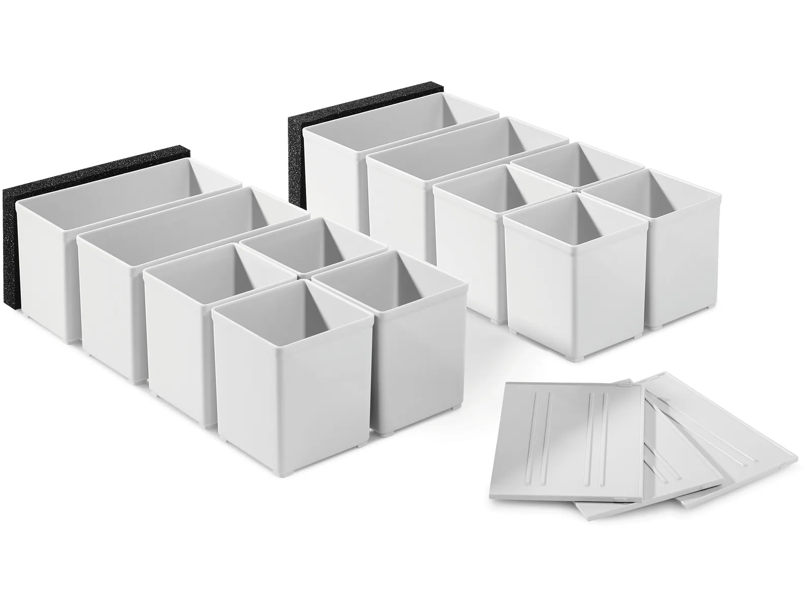 Two white plastic drawer organizers with multiple compartments, black foam on the back, and four removable white dividers nearby.