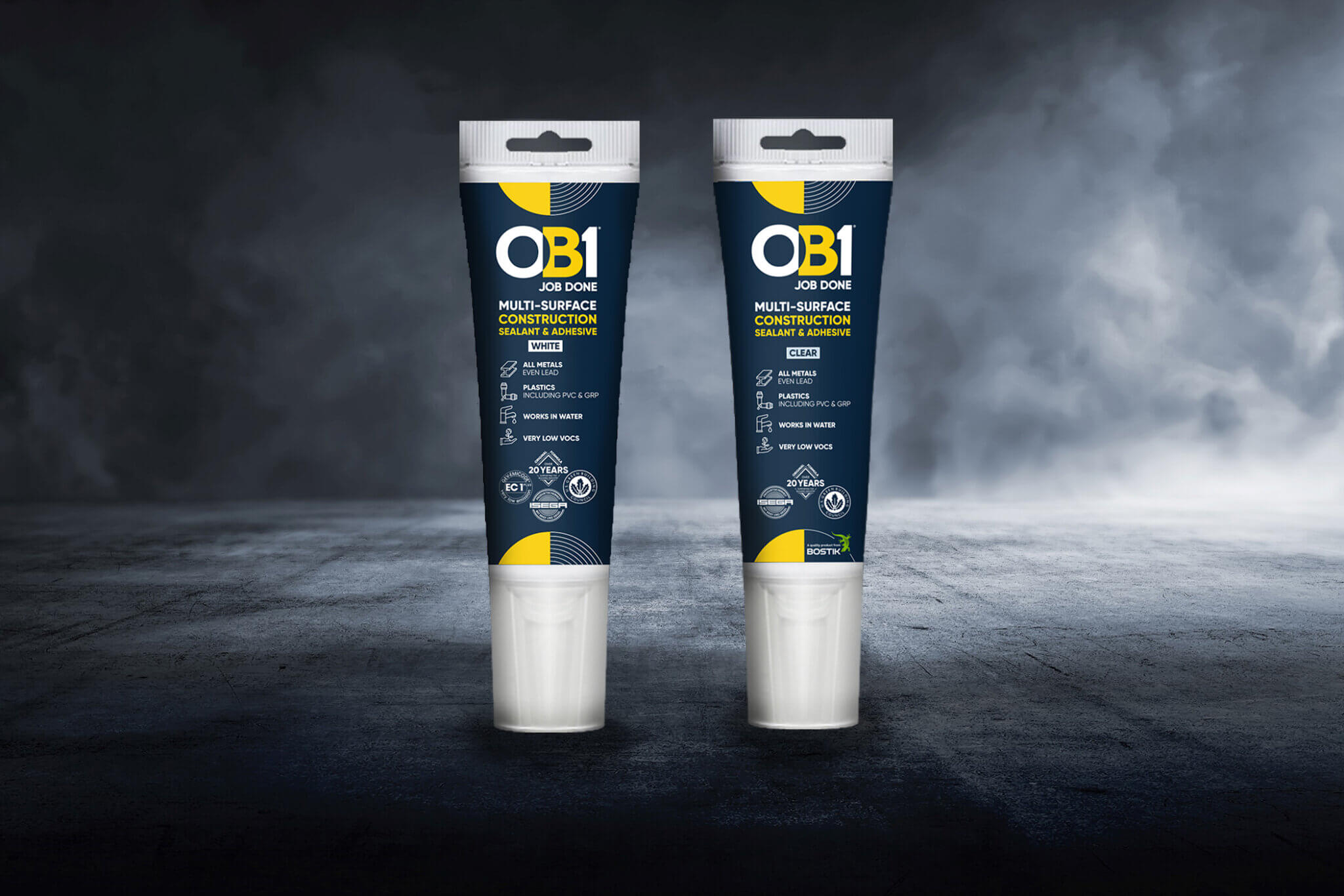 Two OB1 Clear 80ml Single Cartridges with blue and yellow packaging stand side by side on a textured surface, gray background.