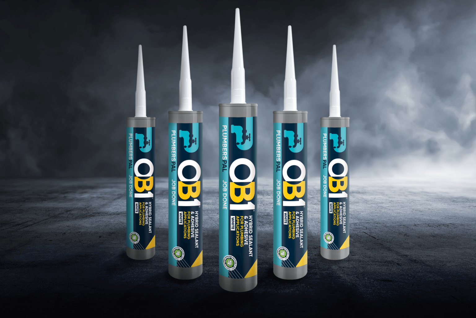 Five OB1 Multi-Layer Paint & Varnish Remover 500ml aerosols on a dark surface with a cloudy backdrop, labels visible.