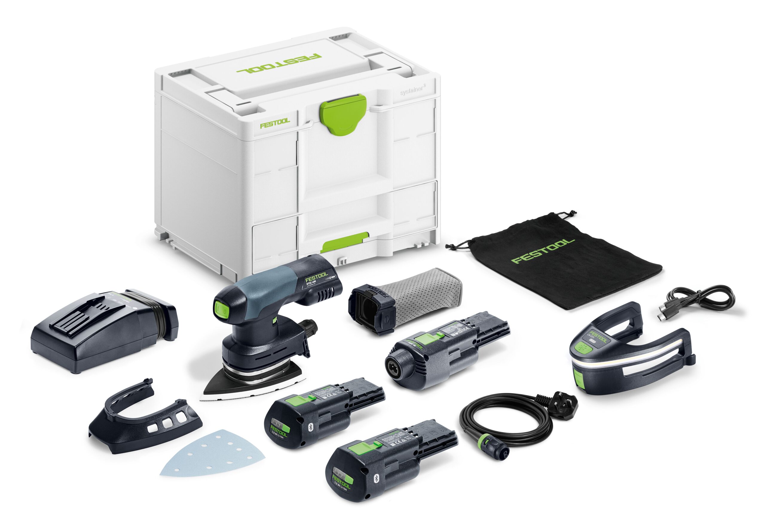 A cordless Festool sander kit with attachments, batteries, charger, sanding pads, dust bag, power cable, and case on a white surface.