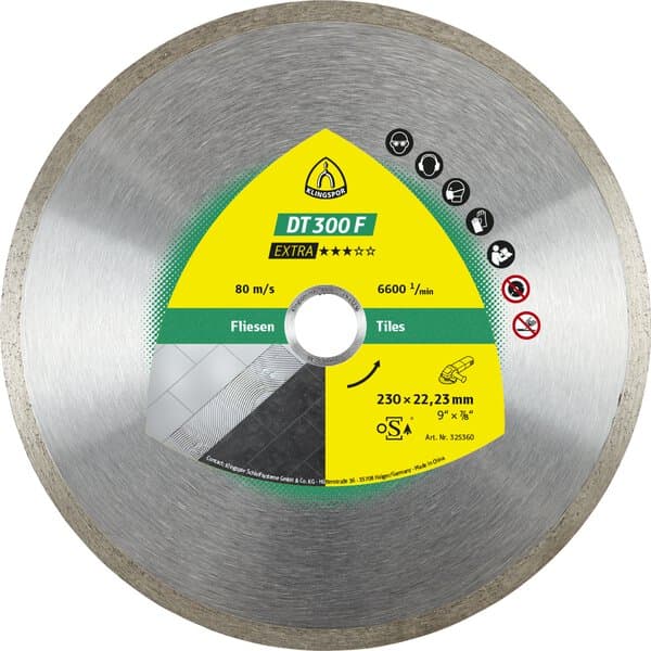 The Klingspor 325357 DT300F Budget Diamond Disc has a silver edge, yellow-green label, safety icons, and cuts tiles.