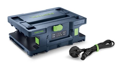 A black and green Festool power supply unit is next to its detachable black cord on a white background, featuring latches and handles.