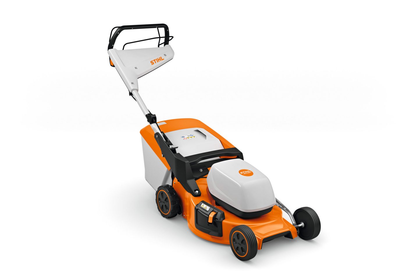 A Stihl RMA 253.3T (AK) lawnmower with orange and white branding, black handle, and rear grass bag is on a white background.