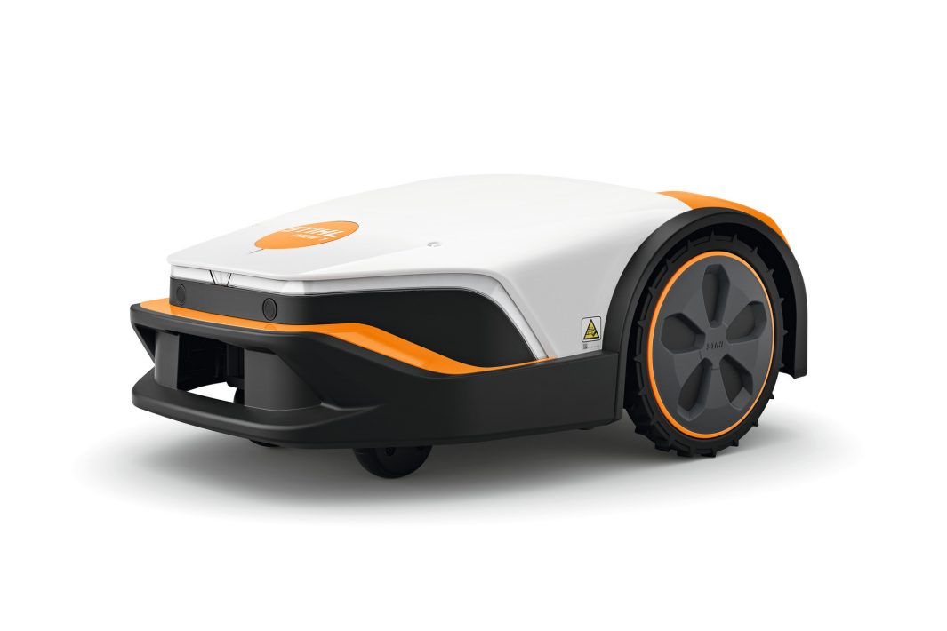The Stihl iMOW 7.0 (GB) Robot mower has a white and orange finish, sleek modern design, and large rear wheels on a plain background.