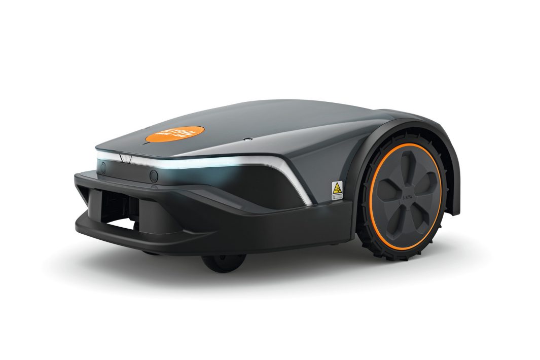 The Stihl iMOW 7.0 EVO Robot Mower has a sleek dark grey body, orange accents, and large rear wheels on a white background.