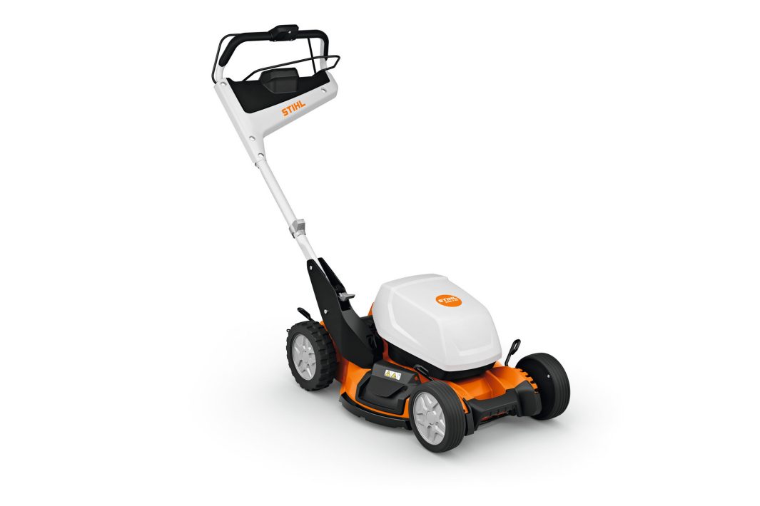 The Stihl RMA 7.0 RV (AP) Lawnmower, with a white and orange body, black handlebar, and four wheels, on a plain white background.